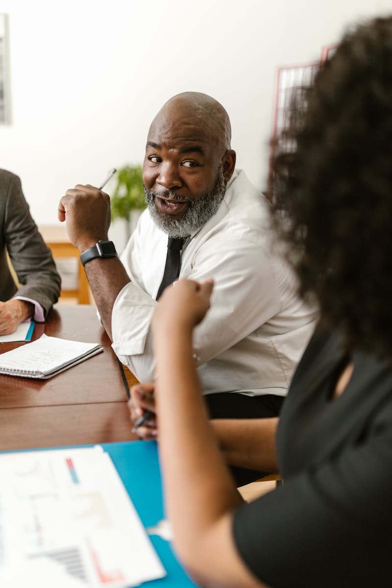 Diverse team discussing project strategies in a modern office setting.
